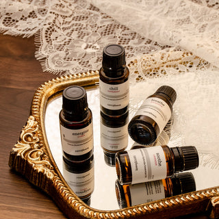 Set of savor beauty essential oils on a decorative tray with lace background