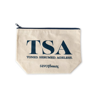 Beige pouch with 'TSA' and 'Savor Beauty' text on a white background