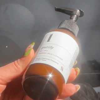 GIF of Jasmine Milk Cleanser being dispensed onto hand