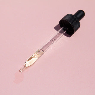 dropper, halfway full of oil.