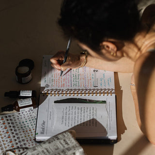 Angela writing in her planner