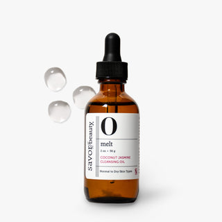 An amber glass dropper bottle of savor beauty 'o melt' coconut jasmine cleansing oil, shown on a clean white background with three clear liquid droplets floating to the left.