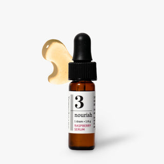 Savor Beauty glass dropper bottle of '3 nourish Raspberry Serum' with a black dropper cap and a white label, shown against a light gray background with a gold serum droplet graphic behind it.