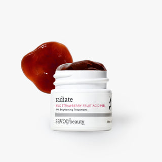 A white jar of Savor Beauty Radiate Wild Strawberry Fruit Acid Peel shown open with dark red peel product visible on top and a matching red gel swatch behind it, on a clean white background.