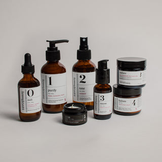 Collection of skincare products on a neutral background