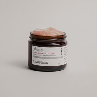 Jar of skincare peel with a white label on a neutral background