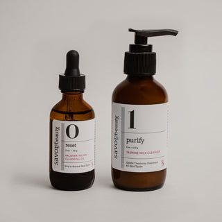 Two brown bottles with labels on a gray background