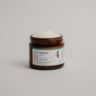 Skincare jar open with whipped face cream over the top