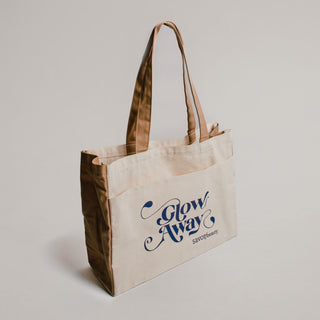 Savor Beauty Canvas tote bag with "glow away" typography