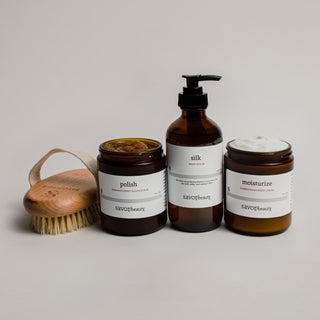 Set of bodycare products with labels on a neutral background