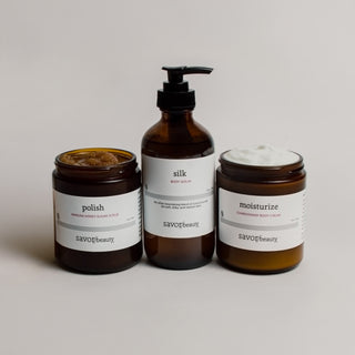 Set of bodycare products with labels on a neutral background