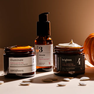 Three skincare products labeled 'illuminate', 'renew', and 'brighten' on a neutral background.